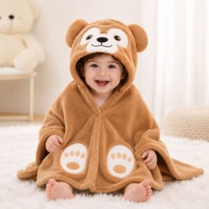 Smiling baby wrapped in a soft brown bear hooded bath towel and baby wrapper